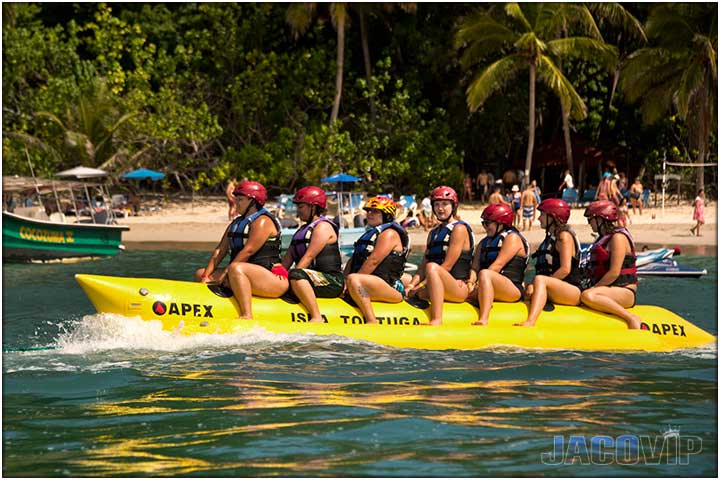 7 people on yellow banana boat