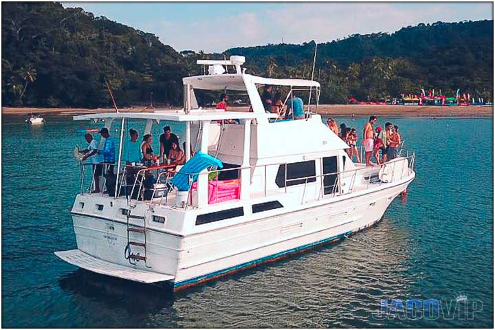 Back side of party boat with beach in background