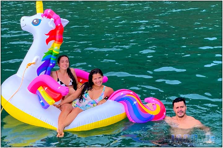 girls hanging out on floating unicorn