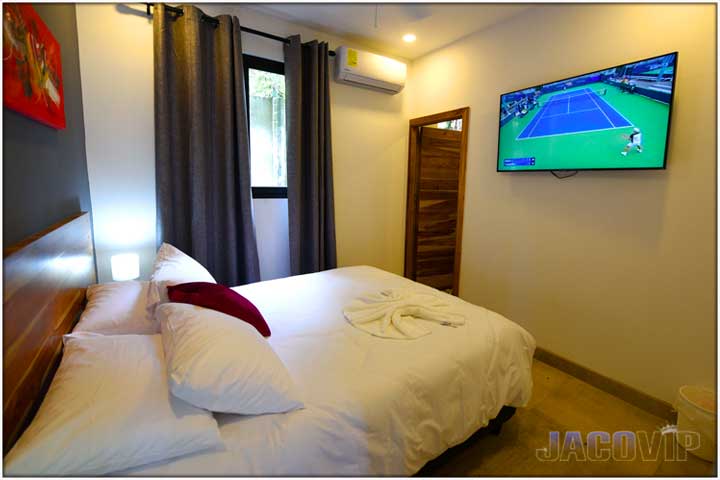 Tennis match on TV in bedroom