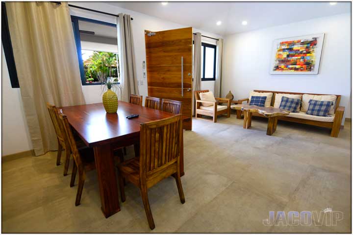 Corner view of living room with wood furniture