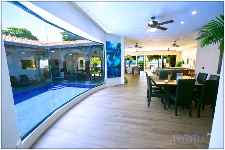 Large windows looking over the swimming pool