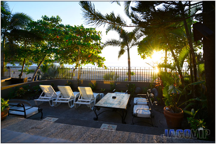 beach front lawn chairs at sunset