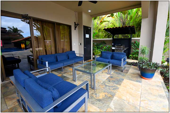 Exterior entrance to bedroom 4 with patio doors leading to pool area