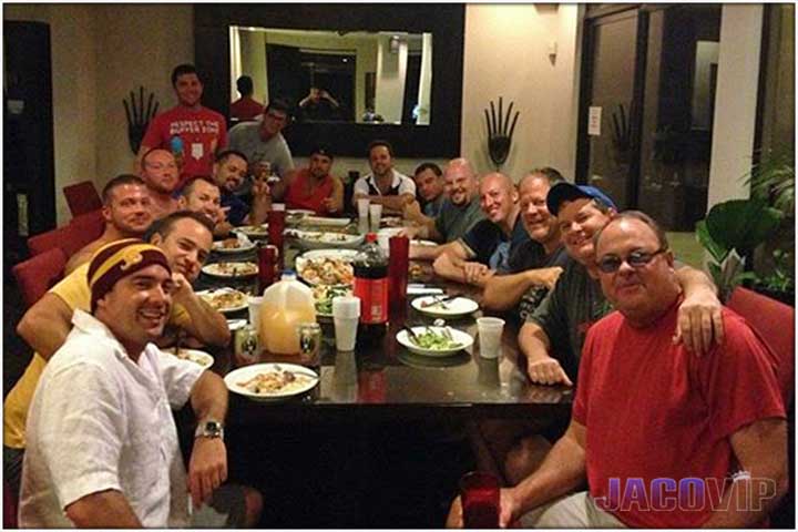 Large dinning table filled with guests