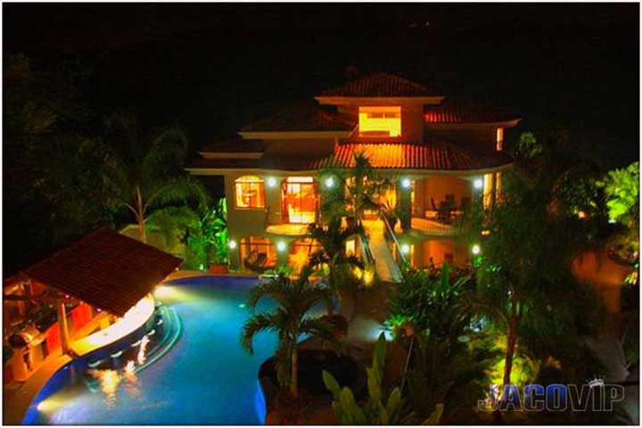 Second building at night with lights on