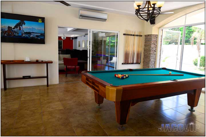 Pool table and entrance to second part of living room