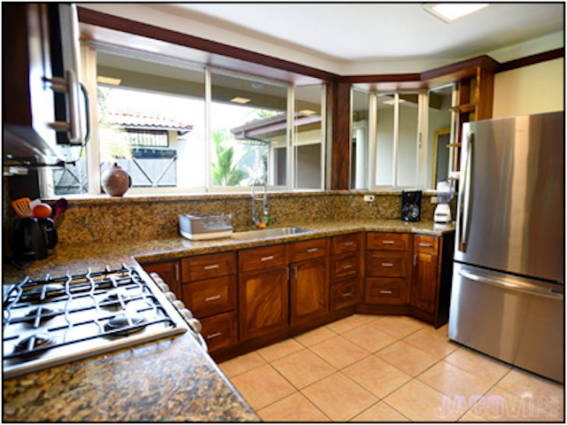 fully equipped kitchen with stainless steel appliances