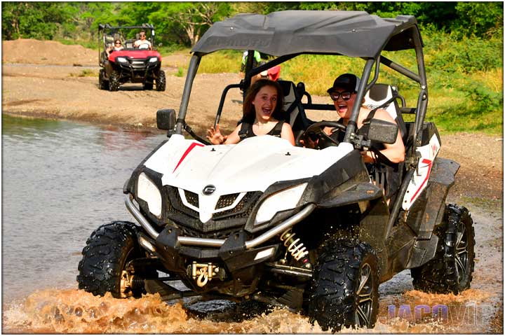 Driving CF Moto UTV across river in Costa Rica