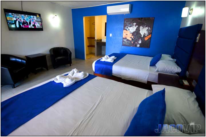 Blue accent wall and blue accessories in bedroom