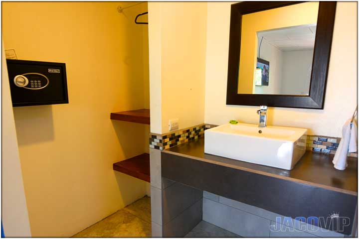 Bathroom with yellow lighting and safe box