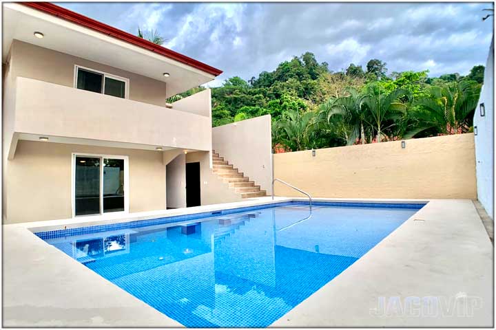 Corner view of swimming pool and Casa Impala in Jaco Beach Costa Rica