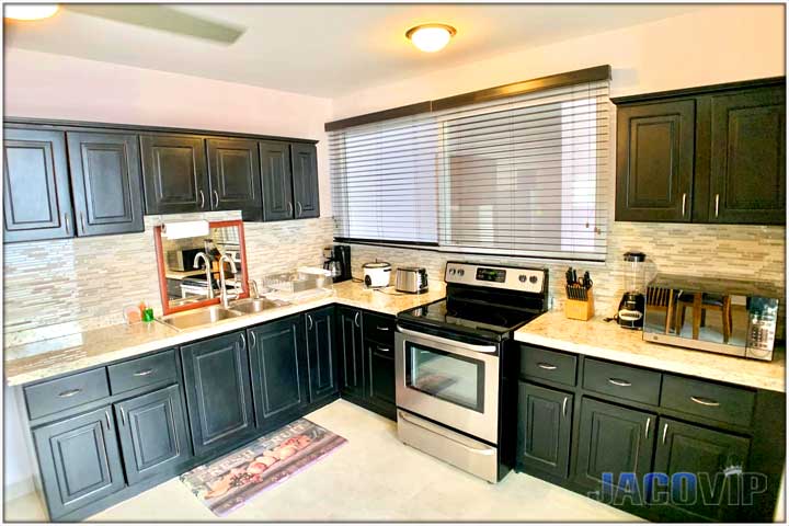 Kitchen with black and grey cabinets