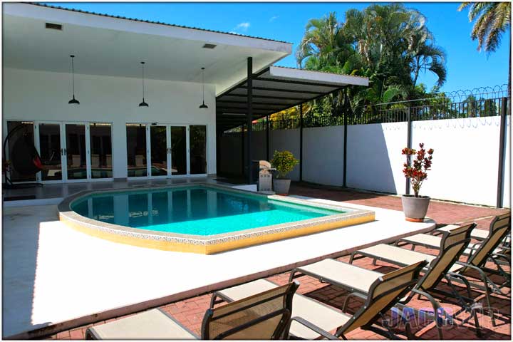 Pool and entrance to first house