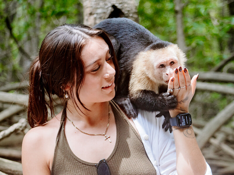 Pretty Girl with monkey on mangrove tour in Costa Rica