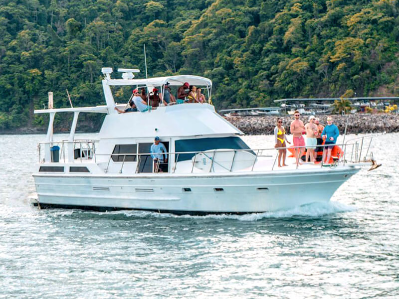 Group of friends on a private party boat yacht in Jaco Costa Rica