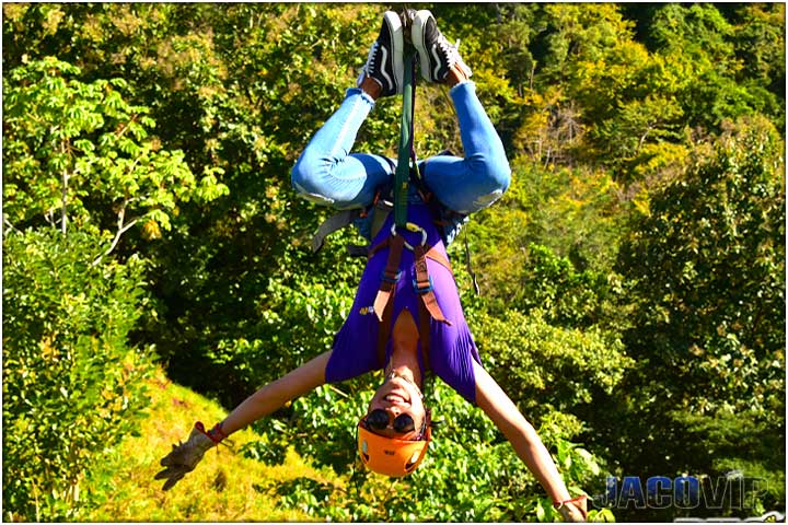 Concierge Upside down on zip line with arms open