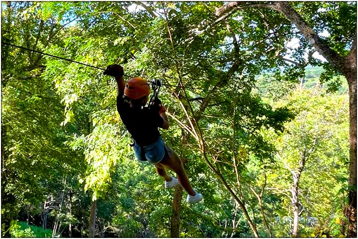 Hanging on zipline in costa rica