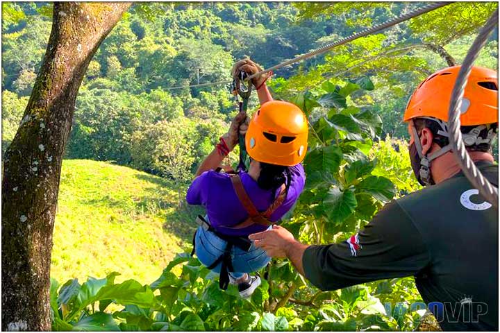 Pretty girl with zipline tour guide