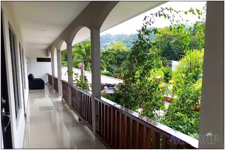 second floor exterior covered hallway between bedrooms