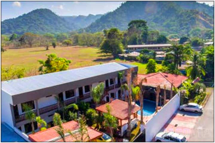 Aerial drone photo of La Limonera Lime House in Jaco with surrounding mountain range