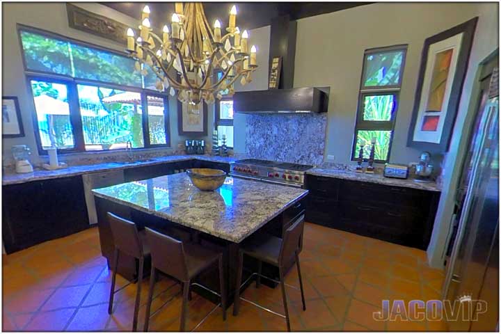 Kitchen area with island for preparing food