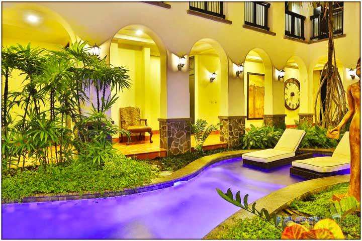 Wide view of courtyard pool at Villa Montine Palacio del Mar