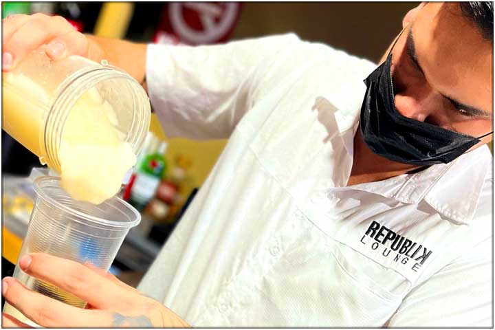 Bartender serving smoothie