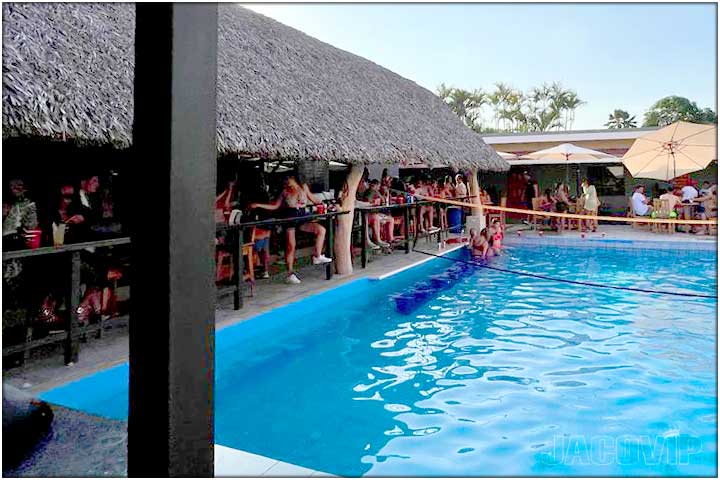 Water volleyball and large crowd at republik pool bar