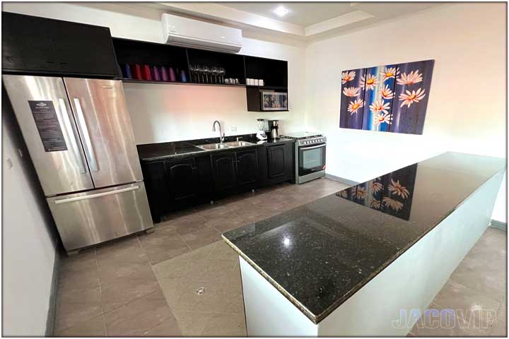 kitchen area with curved island