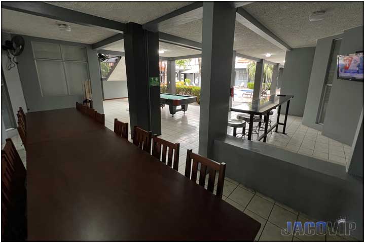 Outdoor pool table in covered area