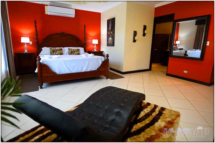 master bedroom with black leather lounge chair