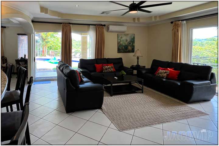 Large living room with open concept kitchen and bar