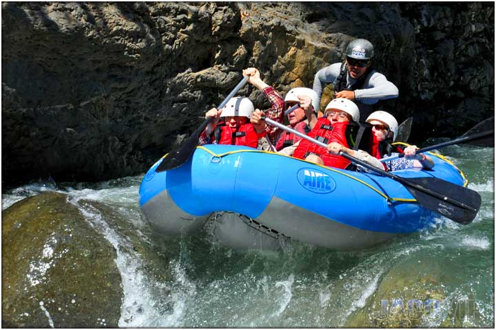 Raft on edge of steep drop in river