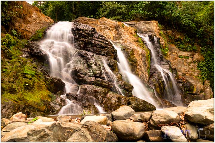 Waterfall into river