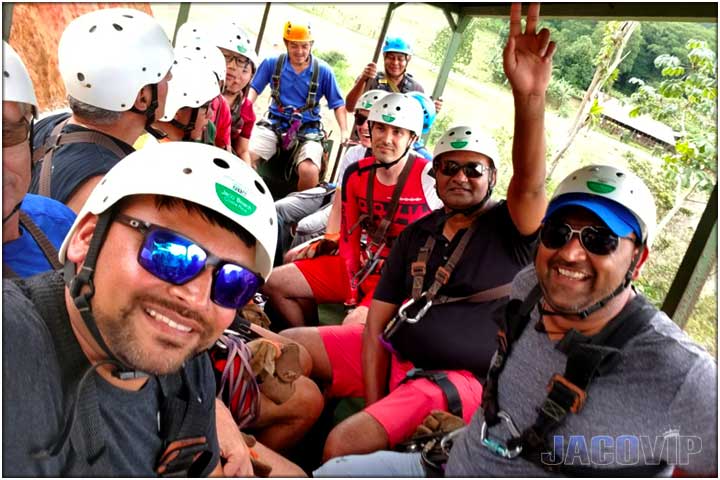 Bachelor party group in tractor on way to zipline tour