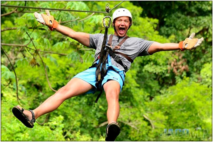 Guy on zipline with arms and legs open